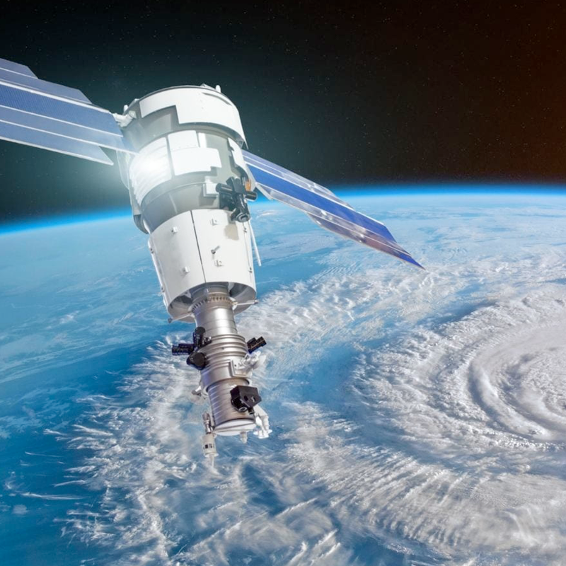 image of a satalite in space with earth as backdrop